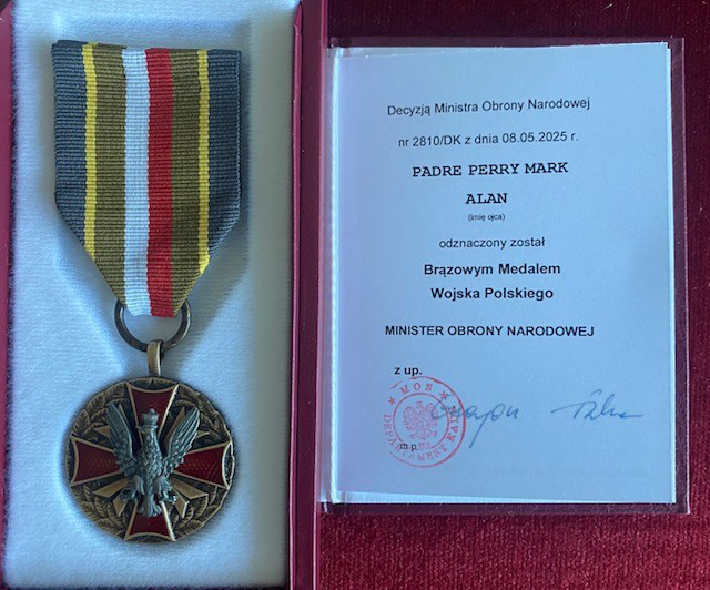 An image of the award medal and its official certificate rest side-by-side in a crimson presentation case.
